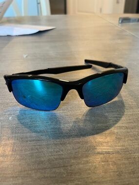 Oakley Black Frame Sunglasses with Blue Lenses